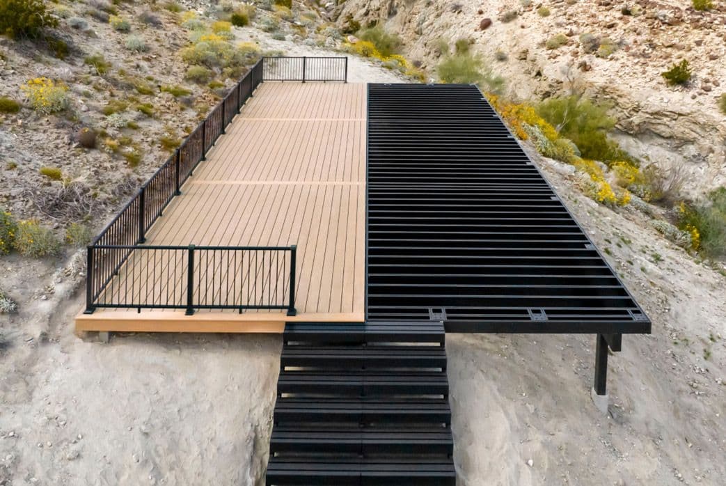 A deck with one half of the aluminum framing exposed.