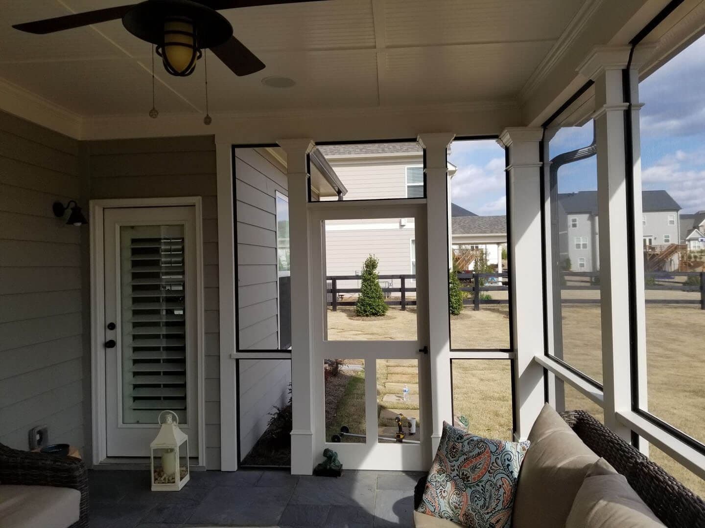An outdoor covered sunroom by Outback Deck.