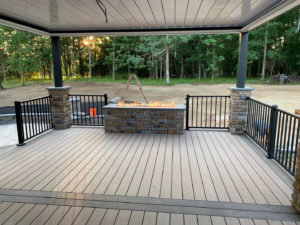 A new patio with a composite deck and fire feature