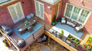 An overhead view of two elevated wood decks on a home.